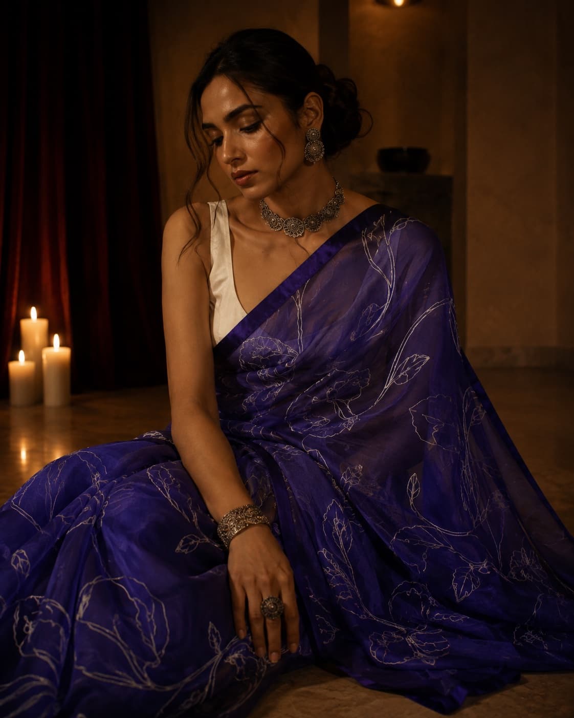 Model wearing NOOR 02 in violet with silver-toned botanical linework